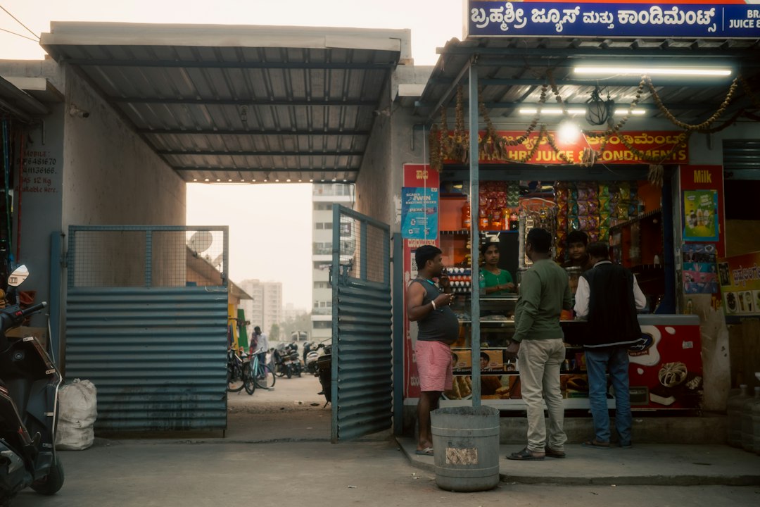 People gather outside a small shop in india